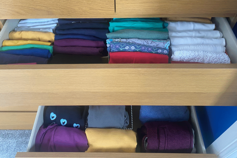 Picture of drawers with tops stored vertically and ordered in colour